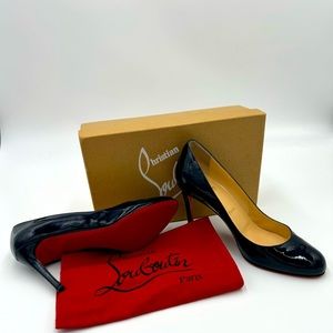 CHRISTIAN LOUBOUTIN deep navy patent leather pumps.